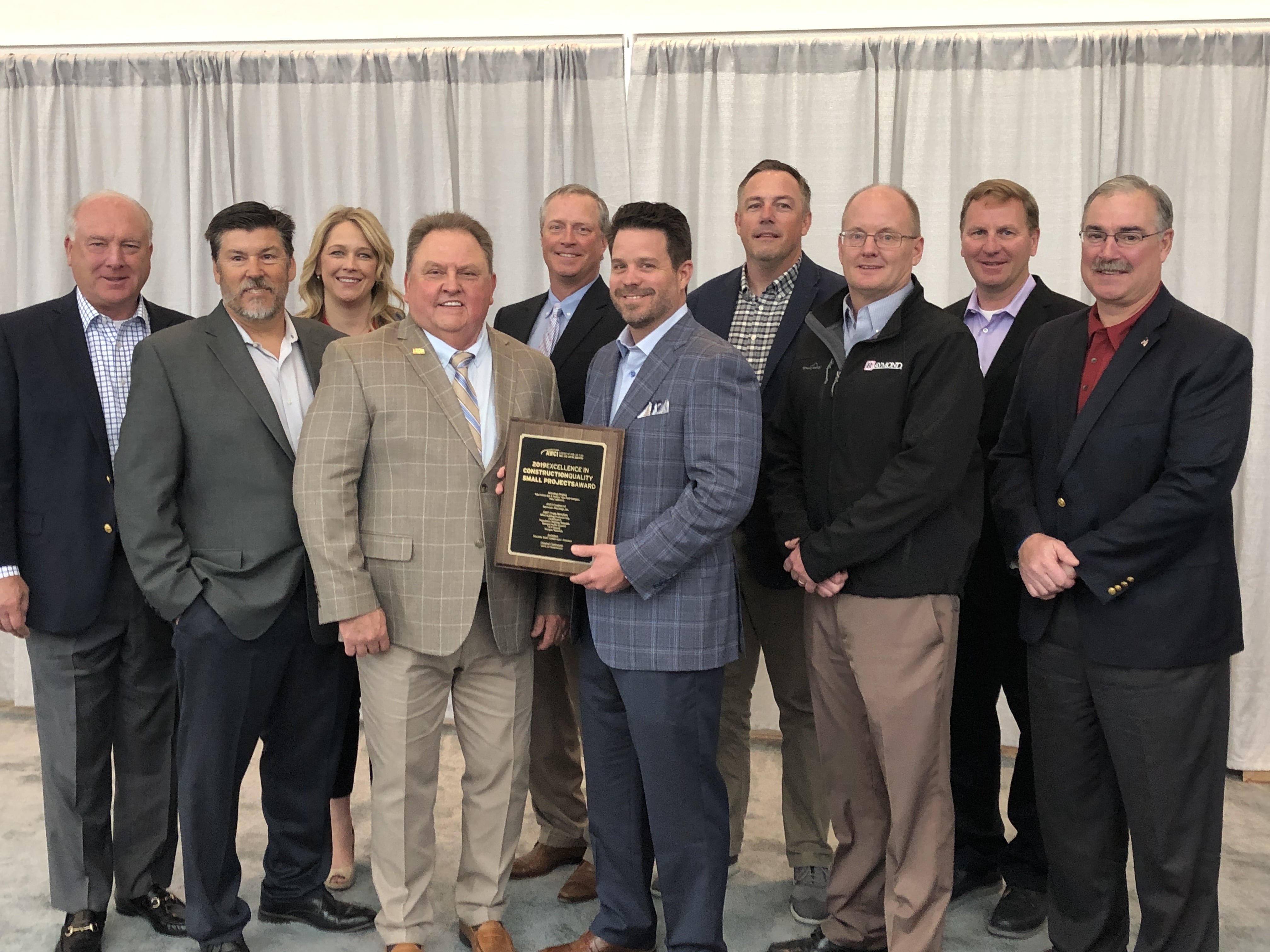 AWCI President Jerry Smith presenting Raymond-San Diego, Inc. with the AWCI Quality Award